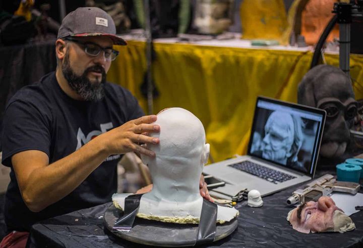 Bob sculpting a character bust during a live demo